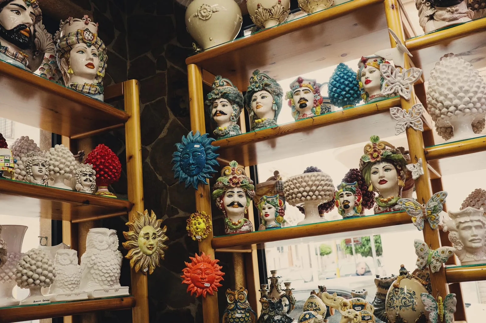 Ceramic heads in a Terrasini storefront